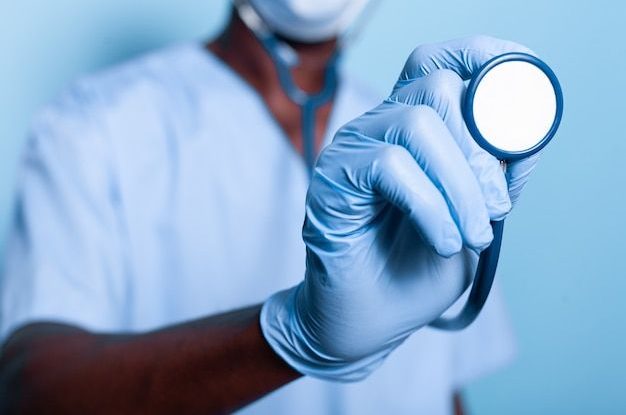 Close up of african american hand holding stethoscope _ Free Photo